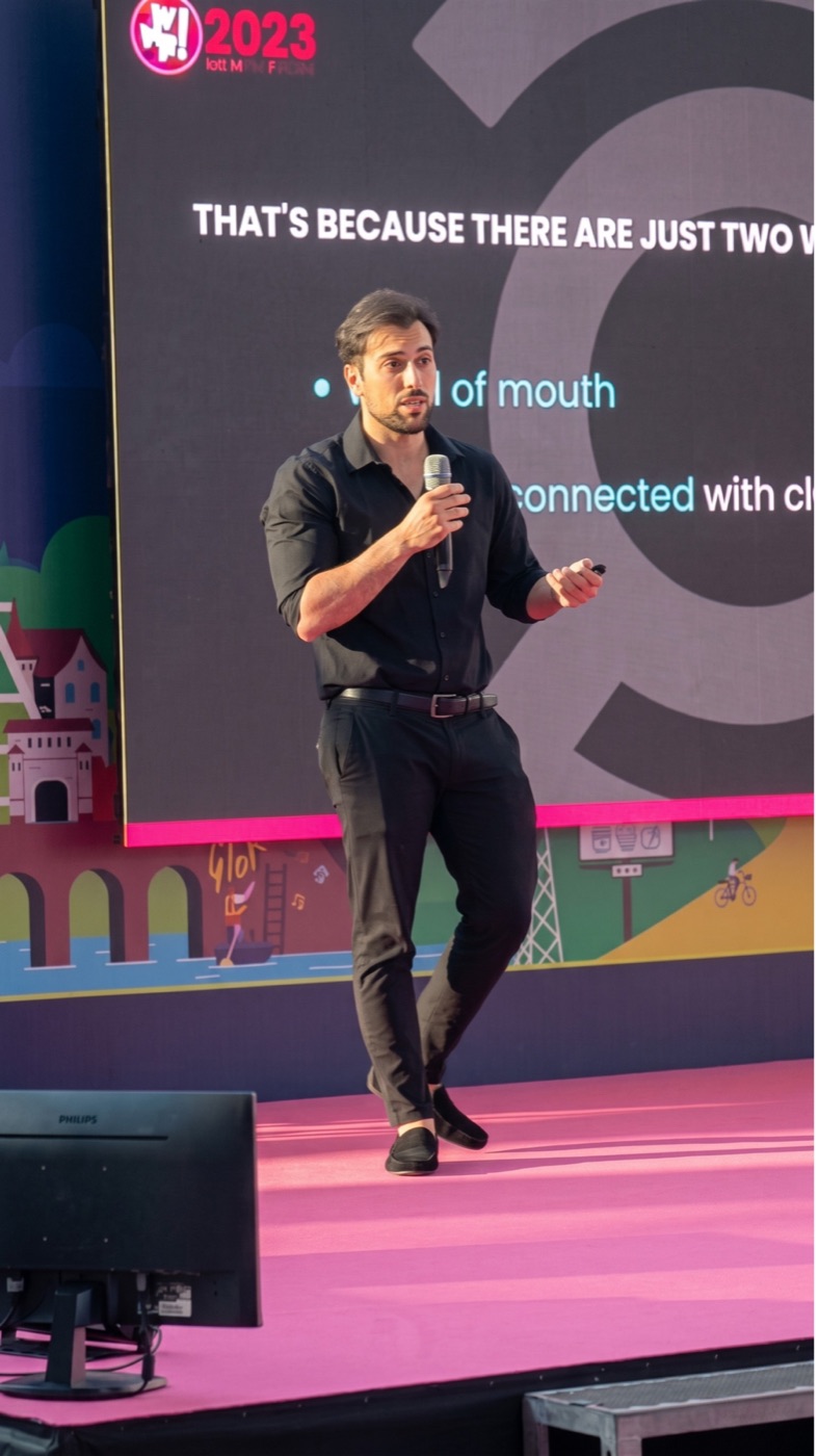 Gennaro Santoro speaking on stage